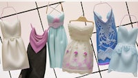 a group of dresses hanging on a rack