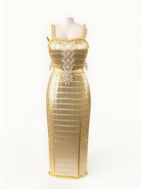 a gold dress on a mannequin