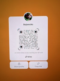 a qr code is displayed on an orange background